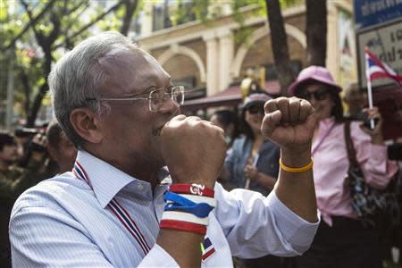 Protest leader Suthep Thaugsuban gestures as he leads anti-government protesters marching through Bangkok's financial district January 23, 2014. REUTERS/Nir Elias