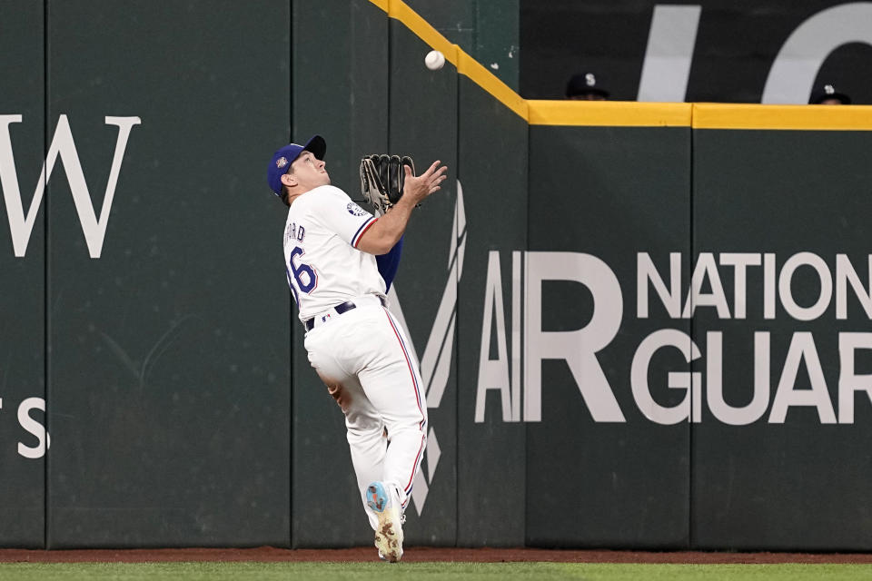 Texas Rangers left fielder Wyatt Langford positions under a fly out by Seattle Mariners' Jorge Polanco in the sixth inning of a baseball game in Arlington, Texas, Thursday, April 25, 2024. (AP Photo/Tony Gutierrez)