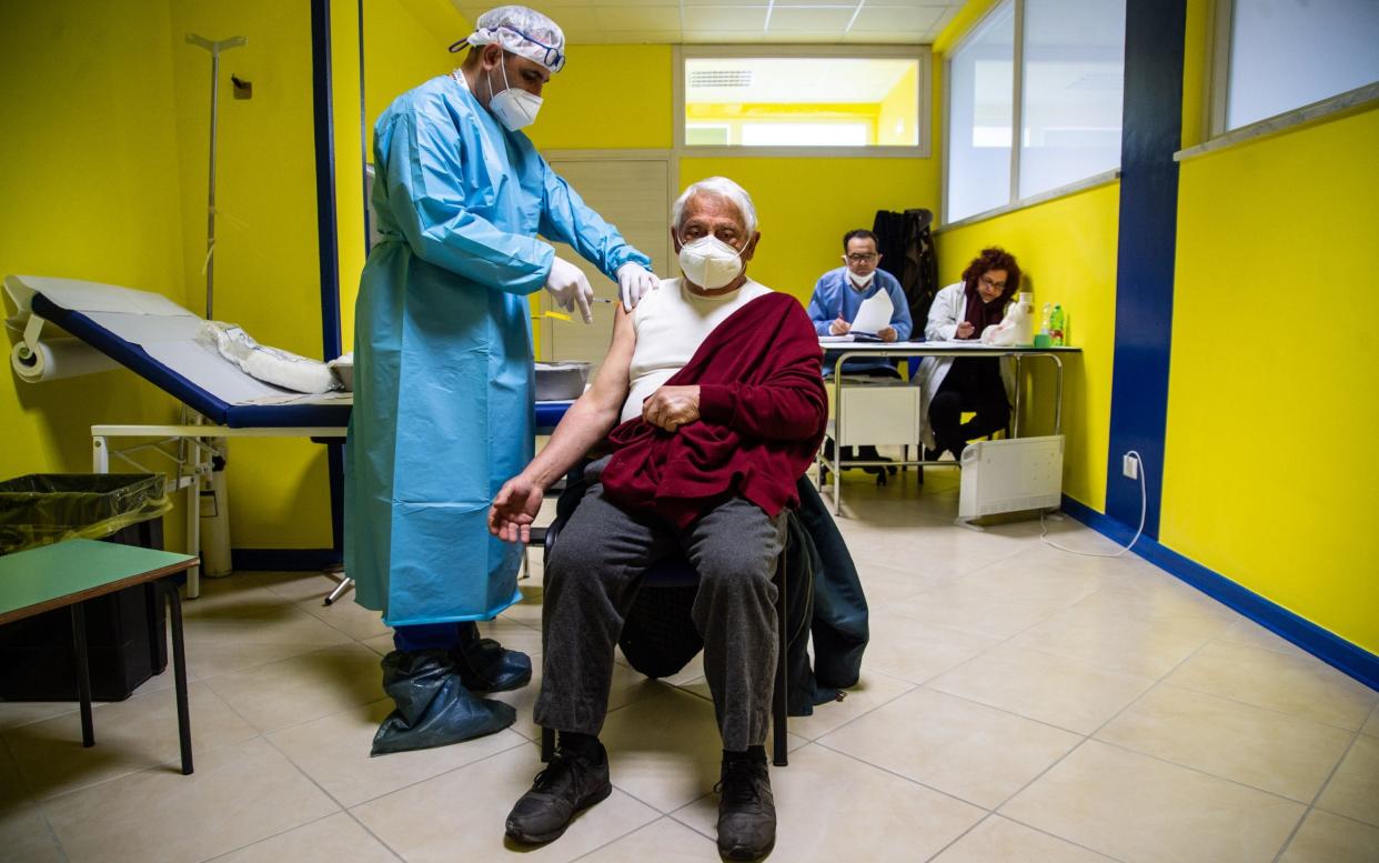An elderly man receives the Pfizer Biontech Covid-19 vaccine in Caselle In Pittari, Italy - Getty
