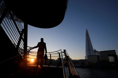 FILE PHOTO: A man walks down a set of stairs at London Bridge in London, Britain, January 20, 2017. REUTERS/Toby Melville/File Photo