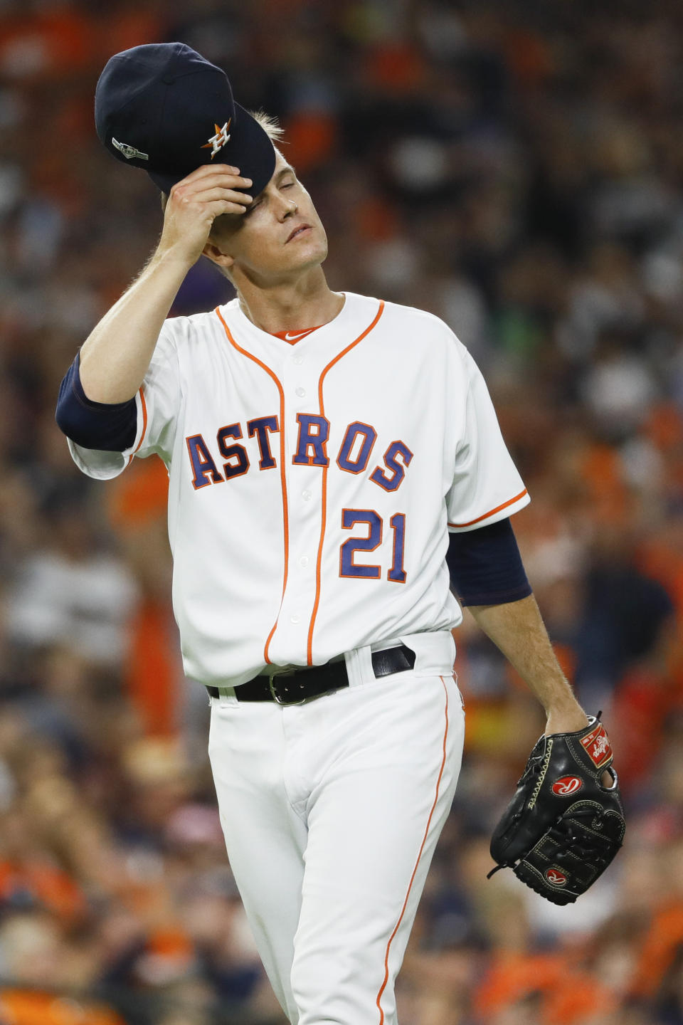 Houston Astros starting pitcher Zack Greinke wipes his face after giving up a run against the New York Yankees during the fourth inning in Game 1 of baseball's American League Championship Series Saturday, Oct. 12, 2019, in Houston. (AP Photo/Matt Slocum)