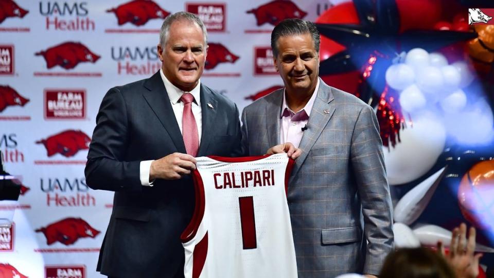 Former Kentucky coach John Calipari, right, was introduced as Arkansas’ head coach by athletics director Hunter Yurachek on Wednesday in Fayetteville, Ark. Arkansas Athletics