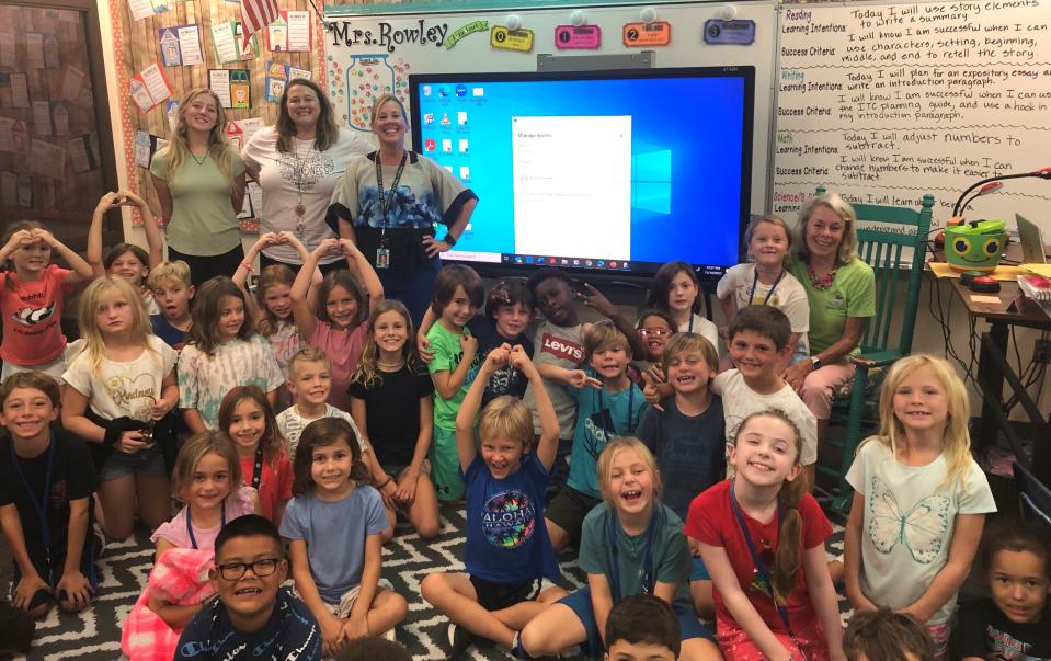 Teachers Kimalee Rowley and Susan Porvaznik lead a reading session with “Bucket Fillers” author Carol McCloud (seated) with second-grade students at Laurel Nokomis School.