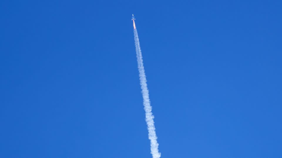 Virgin Galactic's rocket-powered plane flies on its way to the edge of space after taking off from Spaceport America. - Andres Leighton/AP