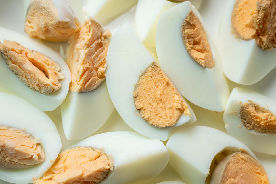 Eggs are rich in protein, especially the egg whites. It's this protein that causes eggs to become hard when boiled.