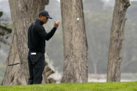 Tiger Woods toss a ball down on the 17th hold during a practice round for the PGA Championship golf tournament at TPC Harding Park Wednesday, Aug. 5, 2020, in San Francisco. (AP Photo/Charlie Riedel)