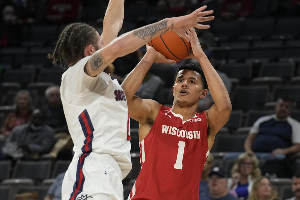 Wisconsin guard Johnny Davis (1) shoots over St. Mary's guard Logan Johnson in the first half during an NCAA college basketball game at the Maui Invitational in Las Vegas, Wednesday, Nov. 24, 2021. (AP Photo/Rick Scuteri)