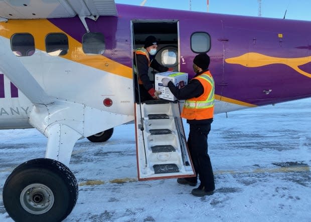 Doses of Moderna's COVID-19 vaccine are loaded onto a plane for delivery to Southend and Wollaston in Saskatchewan.