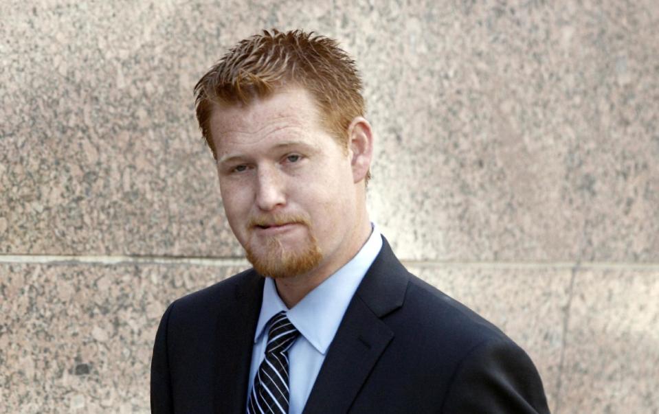 Redmond O'Neal arrives at court Thursday Dec. 12, 2013, to testify in the case of an Andy Warhol portrait of Farrah Fawcett in Los Angeles. Attorneys for Ryan O’Neal concluded their case in the actor’s bid to keep a version of the portrait of Fawcett on Thursday. The former couple’s son Redmond, was among the final witnesses. The University of Texas at Austin is suing Ryan O'Neal to try to gain possession of the portrait. Fawcett left all her artwork to the school and it claims O'Neal improperly took it from her condo days after her death. (AP Photo/Nick Ut)