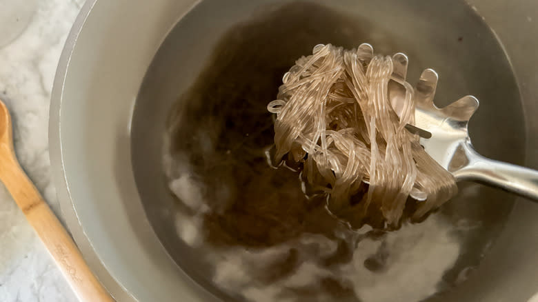 noodles coming out of pot