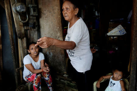 Clarita Alia, 62, talks at her home about her four sons which have died in execution-style killings in Davao, Philippines May 14, 2016. REUTERS/Andrew RC Marshall