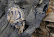 Clothes recovered from the World Trade Center site sit inside Hangar 17 at New York's John F. Kennedy International Airport June 16, 2011. A program operated by the Port Authority of New York and New Jersey, The World Trade Center steel program, is selecting portions of the steel recovered from the Center and donating it to cities, towns, firehouses and museums around the U.S. and the world who request it for use in 911 memorial sites in time for the 10 year anniversary of the 2001 attacks. Picture taken June 16, 2011.( REUTERS/Mike Segar)