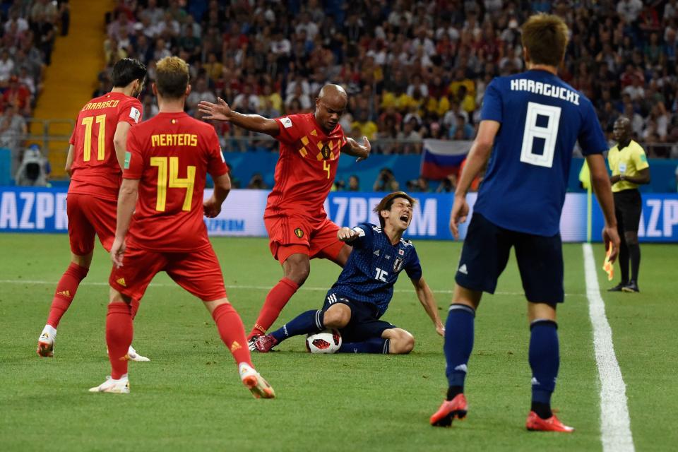 <p>Belgium’s defender Vincent Kompany (3rd-L) vies for the ball with Japan’s forward Yuya Osako (2nd-R) during the Russia 2018 World Cup round of 16 football match between Belgium and Japan at the Rostov Arena in Rostov-On-Don on July 2, 2018. (Photo by JUAN BARRETO / AFP) </p>