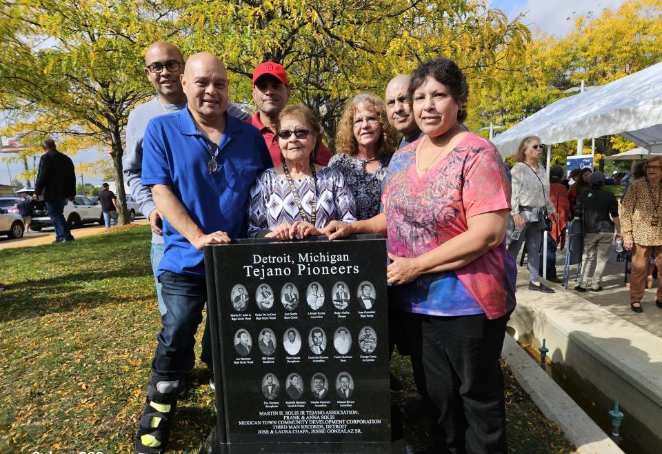Relatives of Adrian's Jose "Joe" Sarabia gather for a picture Sept. 29 around the newly unveiled granite monument in Detroit's Mexicantown. The monument features the names and faces of 16 pioneers who brought the Tejano genre of music to Michigan from Texas. Among them is Sarabia, who died Dec. 23, 2021, at the age of 79.