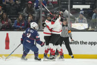 Canada forward Laura Stacey (7) celebrates with forward Kristin O'Neill (43) after scoring during the second period of a rivalry series women's hockey game against the United States Saturday, Nov. 11, 2023, in Los Angeles. (AP Photo/Ashley Landis)