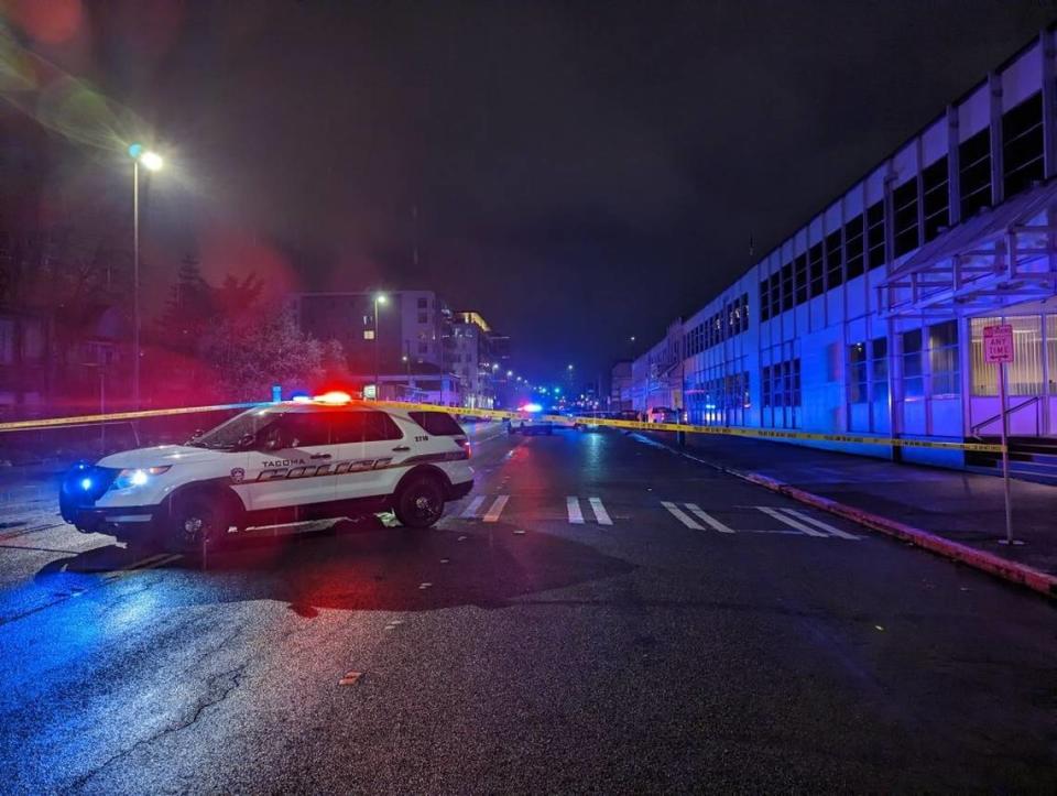 Tacoma Police Department officers at the scene of a hit-and-run vehicle collision Monday, March 20, 2023 on Tacoma Avenue South. Police said a driver ran a red light and hit a car, badly injuring the other driver.