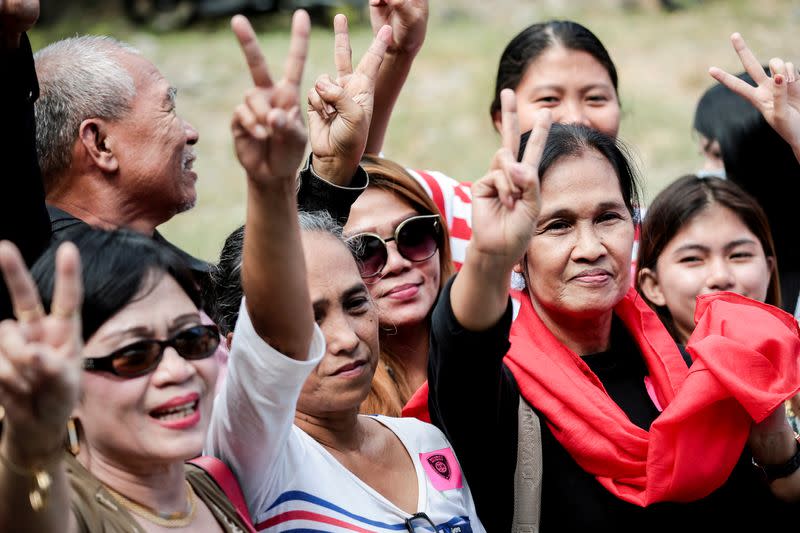 Relatives of victims of the 2009 Maguindanao Massacre gesture in celebration after the case trial in Taguig City