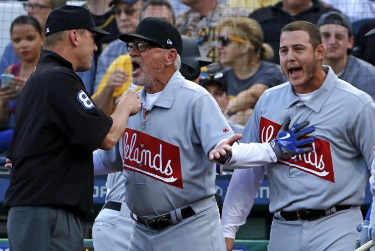 Cubs manager Joe Maddon and first baseman Anthony Rizzo argue with umpire Jeff Kellogg over a home run call that was overturned. (AP)