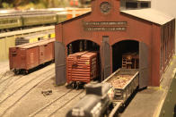 A train waits in the entrance way to a shop. After 67 years in the Liberty Village location, The Model Railroad Club of Toronto will be moving to make way for a condo.