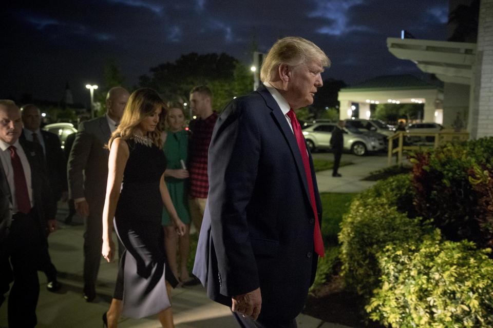 President Donald Trump and first lady Melania Trump arrive for Christmas Eve service at Family Church Downtown in West Palm Beach, Fla., Tuesday, Dec. 24, 2019. (AP Photo/Andrew Harnik)