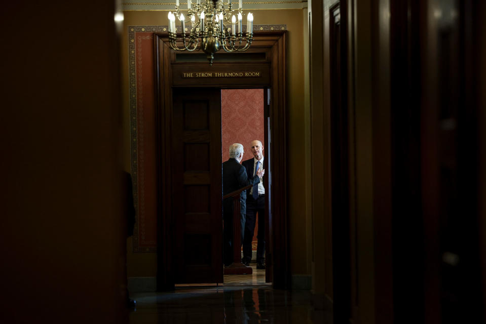 Senate Minority Leader Mitch McConnell speaks with Sen. Rick Scott before a meeting with Republican Senators on their party's plan for the vote on the debt limit at the Capitol on Oct. 07, 2021.<span class="copyright">Anna Moneymaker—Getty Images</span>