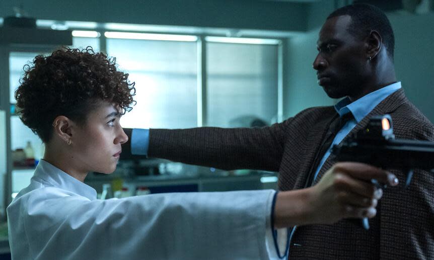 <span>Nathalie Emmanuel and Omar Sy in The Killer.</span><span>Photograph: NBCU</span>