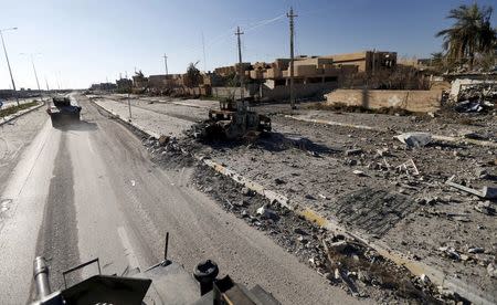 A military vehicle of the Iraqi security forces is driven in the streets of Ramadi, in this January 16, 2016 file photo. REUTERS/Thaier Al-Sudani/Files