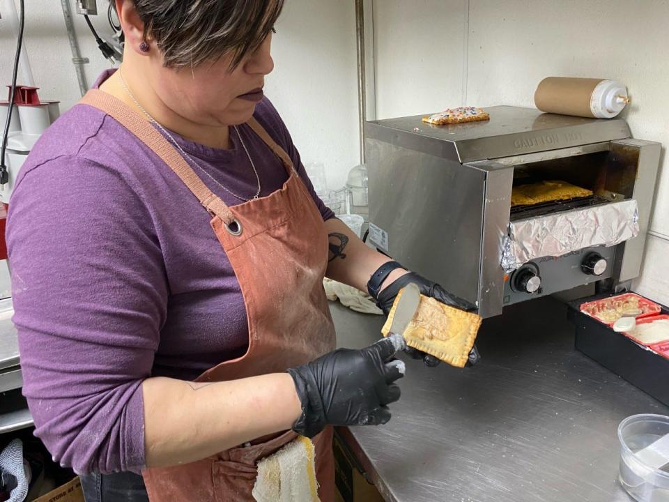 Anabel Meza ices a tart fresh from the toaster at Stitch in Oklahoma City.