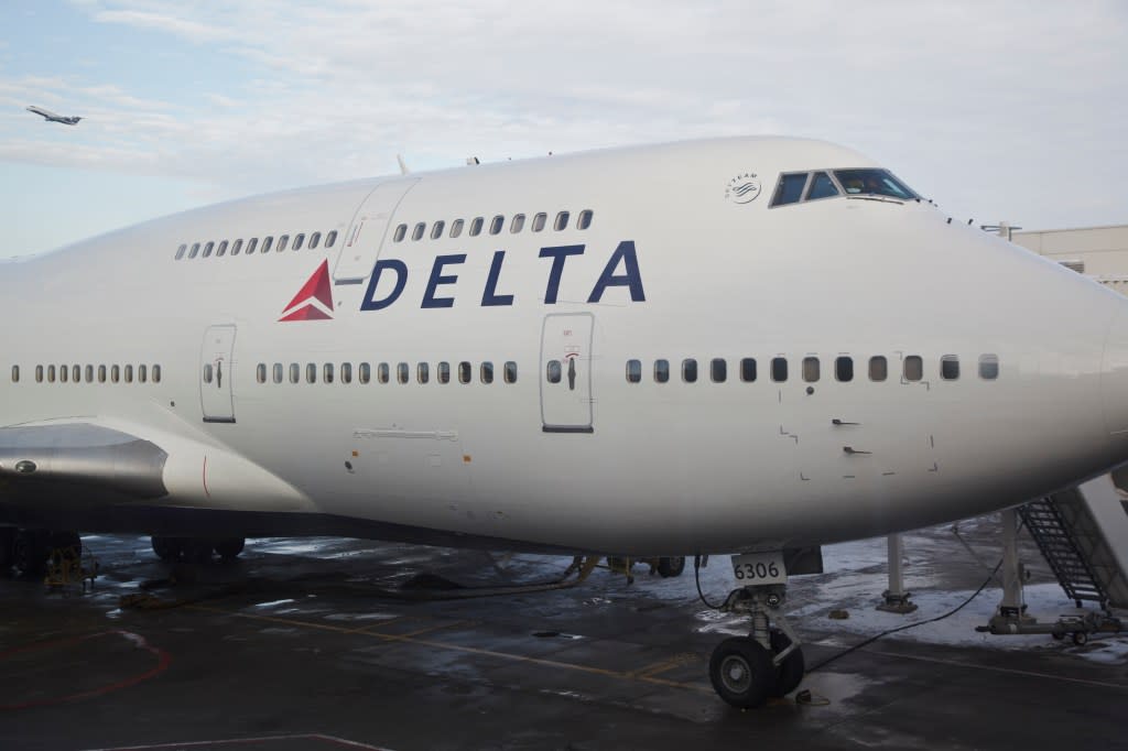 Miller says she opened a Delta credit card that gives her a 15% discount, noting that she purchases flights way in advance. Corbis via Getty Images