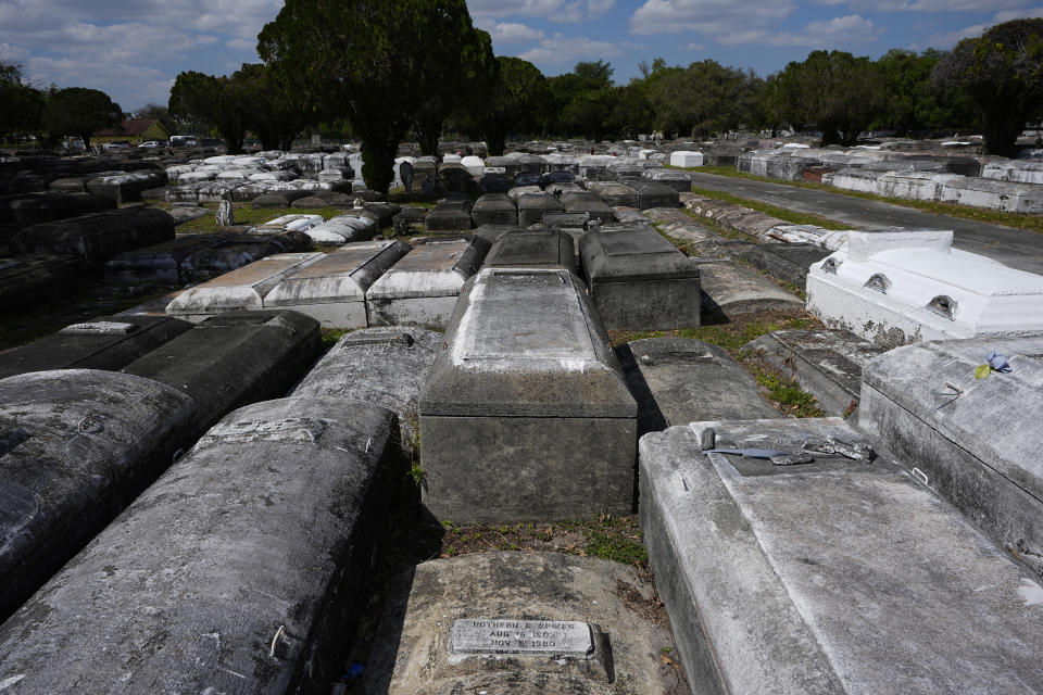 Above ground crypts are placed next to each other at the Lincoln Memorial Park Cemetery, Monday, Feb. 26, 2024, in the Brownsville neighborhood of Miami. The 20-acre cemetery holds the remains of over 10,000 local Black Americans, with some tombs dating to the late 19th century. (AP Photo/Marta Lavandier)