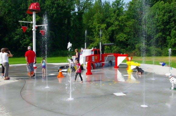 Children splash at the First Responders spray park in Webster. (File)