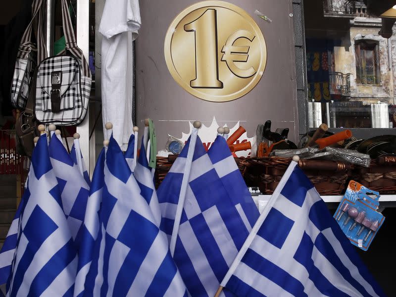 Greek national flags are displayed for sale at the entrance of a one Euro shop in Athens March 2, 2015. REUTERS/Alkis Konstantinidis