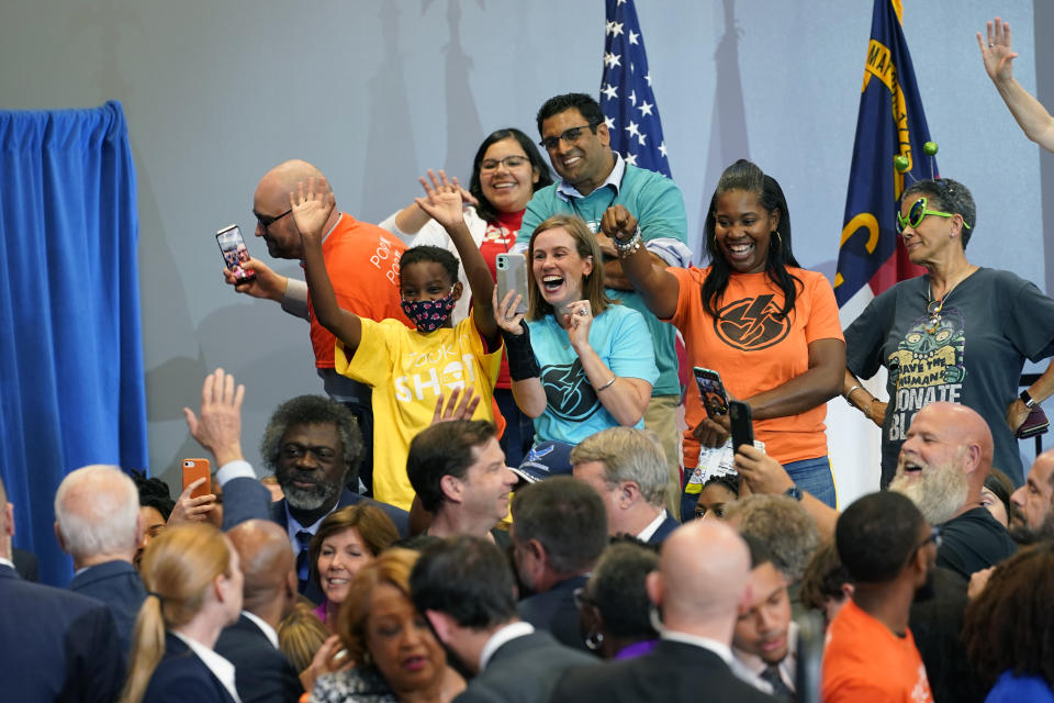 President Joe Biden waves to members of the crowd after speaking during a visit to a mobile COVID-19 vaccination unit at the Green Road Community Center in Raleigh, N.C., Thursday, June 24, 2021. (AP Photo/Susan Walsh)