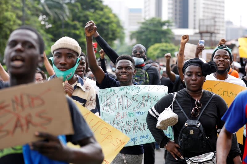 Nigerians take part in a protest against alleged violence, extortion and harassment from Nigeria's Special Anti-Robbery Squad (SARS), in Lagos