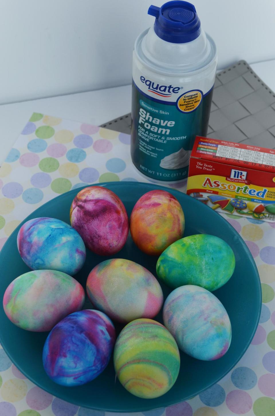 This undated photo provided by A Thrifty Mom shows the use of shaving cream and liquid food coloring to dye hard-boiled eggs which gives them a tie-dyed effect. It's a tactile project most kids will enjoy. “Using shaving cream our kids thought it smelled great and had fun at every part of the project!" writes Sarah Barrand at her A Thrifty Mom blog. (AP Photo/A Thrifty Mom, Sarah Barrand)