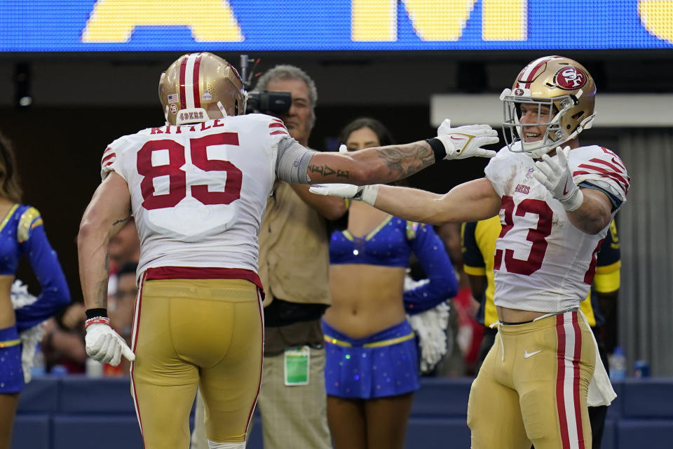 San Francisco 49ers tight end George Kittle, left, celebrates his touchdown with running back Christian McCaffrey during the second half of an NFL football game against the Los Angeles Rams Sunday, Oct. 30, 2022, in Inglewood, Calif. (AP Photo/Gregory Bull)