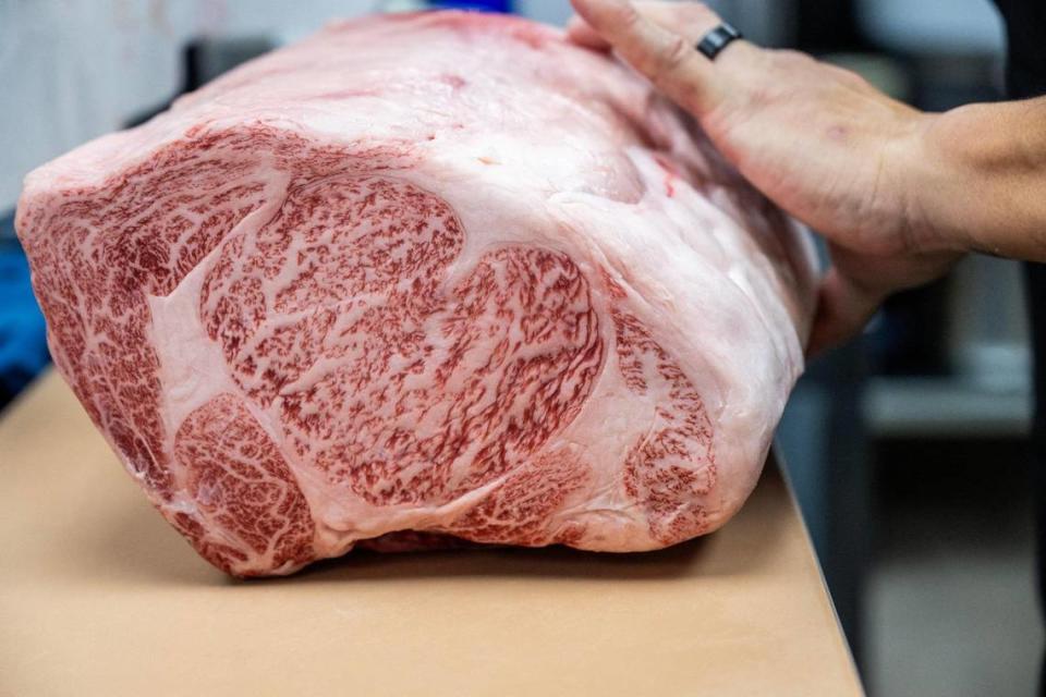 Anh Pham, head chef, shows a piece of A5 Japanese Wagyu before storing it away in a cooler at Kata Nori. The beef is imported directly from Japan.