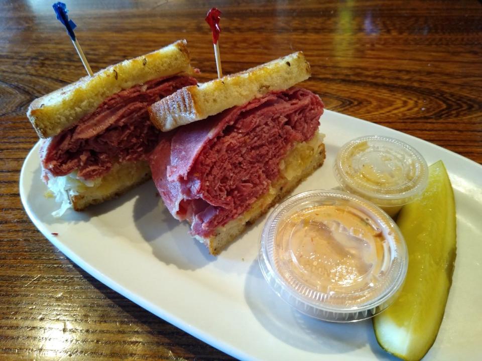 This is the lite version of the Reuben at Slyman’s Tavern in Independence. The sandwich comes with a pickle and sides of Thousand Island dressing and horseradish.