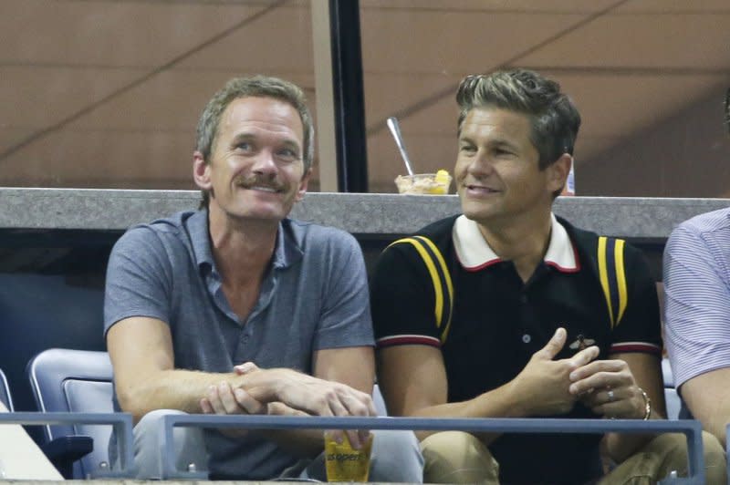 Neil Patrick Harris (L) and David Burtka attend the U.S. Open tennis championships in 2019. File Photo by John Angelillo/UPI