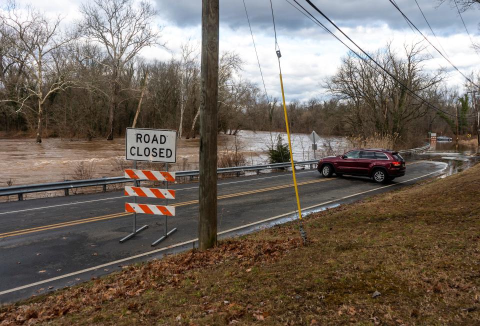 A driver turns around at a flooded portion of Newportville Road on Jan. 10, 2024, after severe flooding. Starting Monday, Newportville Road will close between Zimmerman lane and New Falls Road for bridge work.
