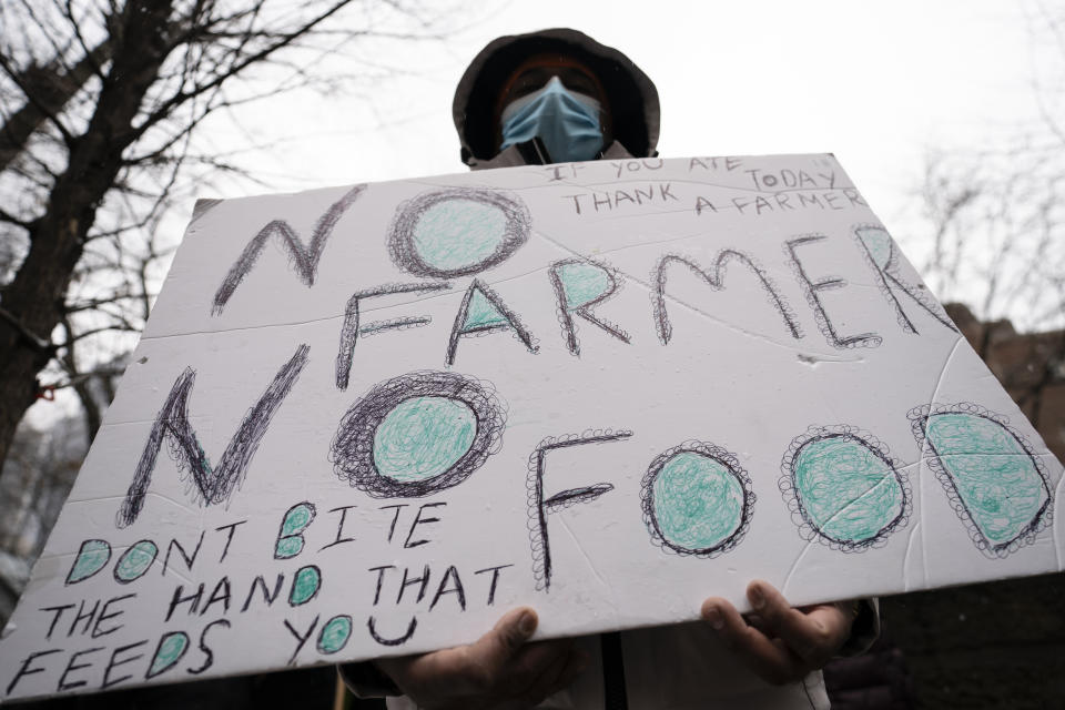 Protesters gather outside the Consulate General of India, Tuesday, Jan. 26, 2021, in the Manhattan borough of New York. Tens of thousands of protesting farmers have marched, rode horses and drove long lines of tractors into India's capital, breaking through police barricades to storm the historic Red Fort. The farmers have been demanding the withdrawal of new laws that they say will favor large corporate farms and devastate the earnings of smaller scale farmers. Republic Day marks the anniversary of the adoption of India’s constitution on Jan. 26, 1950. (AP Photo/John Minchillo)