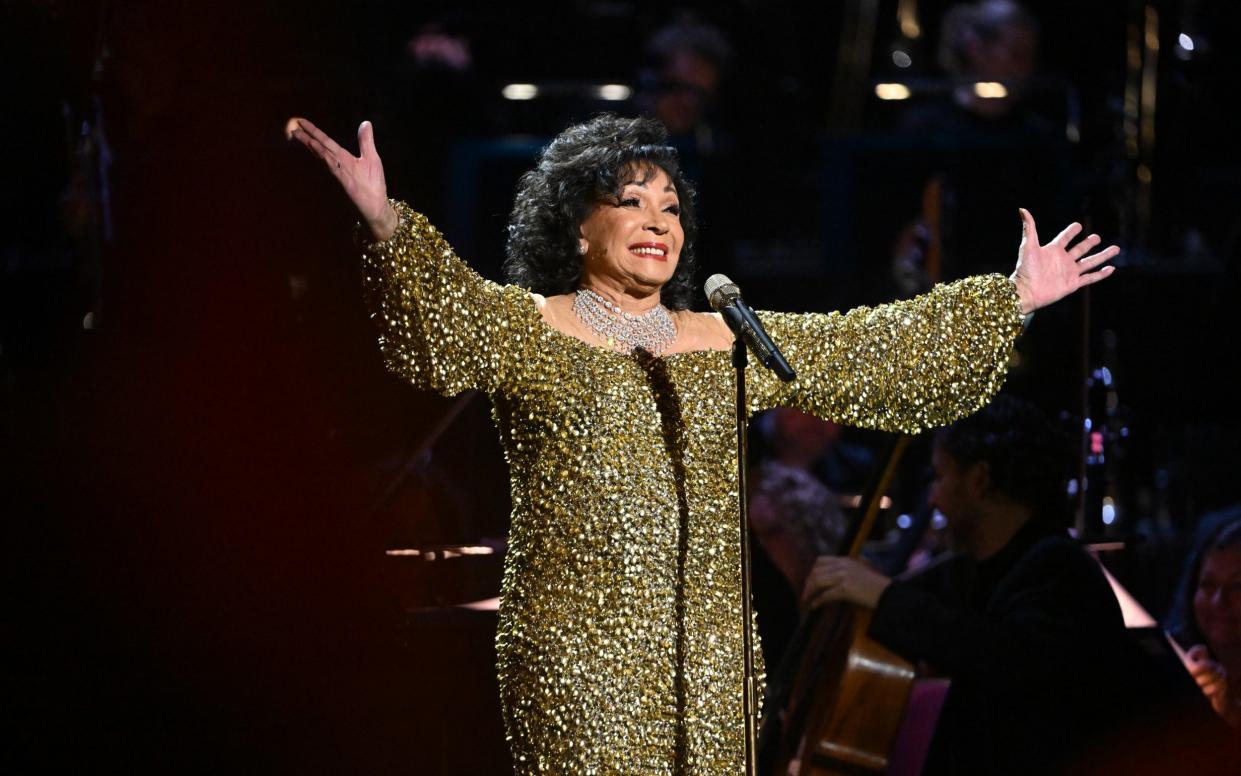 Dame Shirley Bassey performs on stage accompanied by The Royal Philharmonic Concert Orchestra