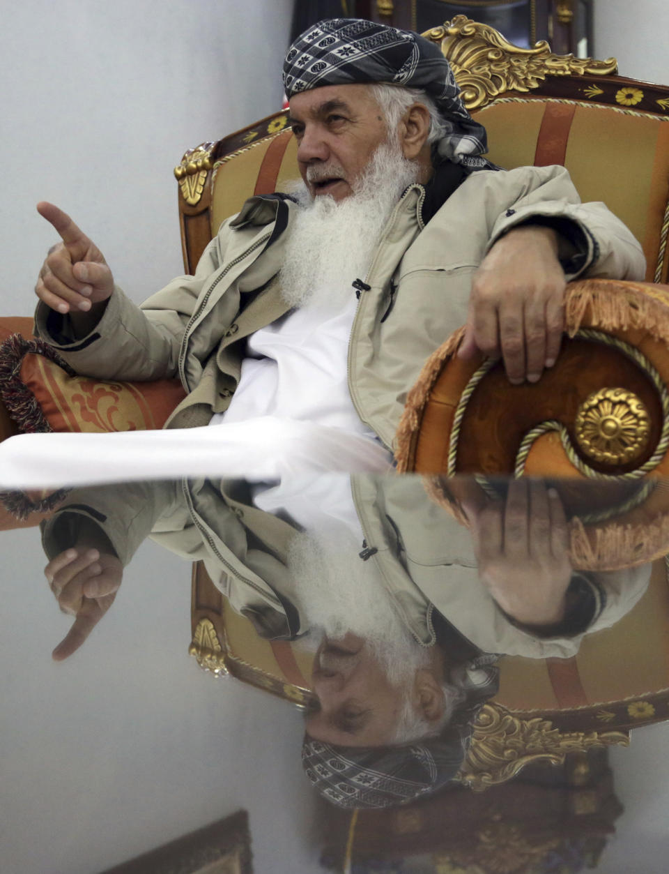 Former Afghan Cabinet Minister Ismail Khan, speaks during an interview with the Associated Press in Herat province, western of, Afghanistan, Wednesday, Feb. 20, 2019. A powerful political leader, who was previously tapped by some to lead Afghanistan’s negotiating team with the Taliban, warned Afghanistan’s president Wednesday against squandering an opportunity to find a peaceful settlement to the country’s latest war that is now into its 18th year. (AP Photo/Rahmat Gul)