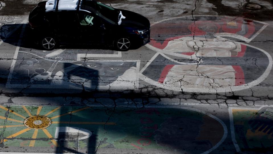 Local artists painted a Black Lives Matter mural in front of Cincinnati City Hall after civil rights protests swept through the nation last summer. The mural has since deteriorated.