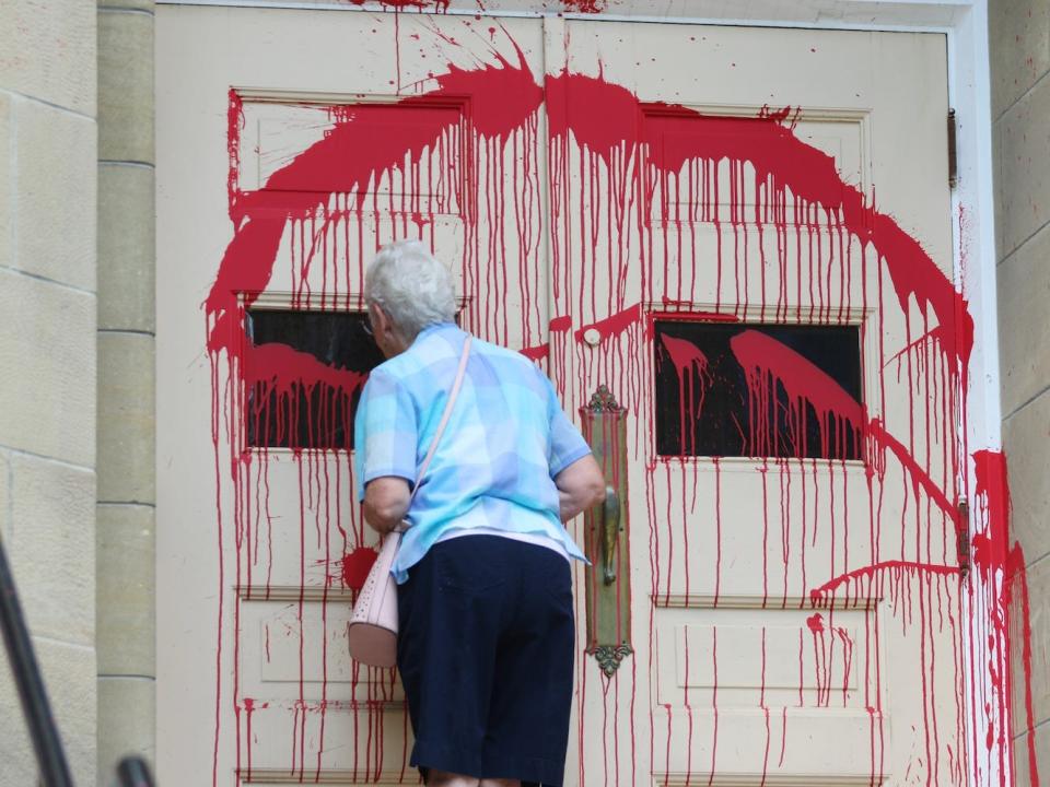 church doors covered in red paint in Calgary, Cana