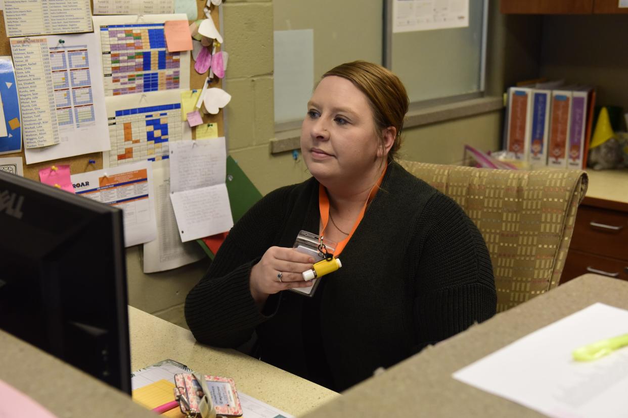 Melanie Schaffner, the attendance secretary for Galion Middle School, waits for an alarm as she puts the school district on lockdown during a test of the safety system.