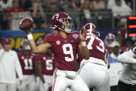 Alabama quarterback Bryce Young (9) throws a pass against Cincinnati during the first half of the Cotton Bowl NCAA College Football Playoff semifinal game, Friday, Dec. 31, 2021, in Arlington, Texas. (AP Photo/Jeffrey McWhorter)