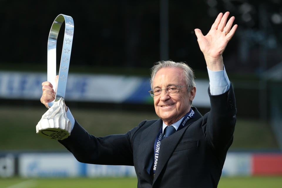 Real Madrid President Florentino Perez (pictured) with the trophy following Madrid's 3-2 victory in the UEFA Youth League Final.