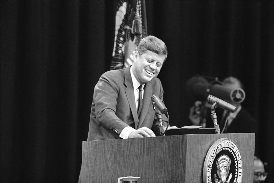 President John F. Kennedy joins in the laughter at his news conference in Washington on April 18, 1962. (Photo: AP)