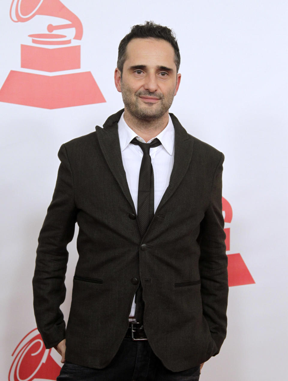 FILE - This Nov. 9, 2011 file photo shows musician Jorge Drexler, of Uruguay, at the Latin Recording Academy Person of the Year tribute to Shakira in Las Vegas. A mobile phone application Drexler created with Wake App designers will debut three new songs. He presented the project at the Billboard Latino Music Conference Tuesday in Miami. In Spain, it's already become a number one iTunes store app. (AP Photo/Julie Jacobson, file)